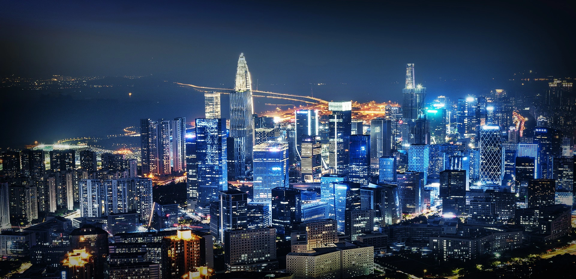 Connected smart city skyline at night with intelligent urban infrastructure
